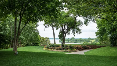Open lawns and mature trees frame White Rock Lake