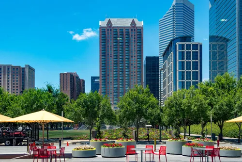 A seating area across the street from the park