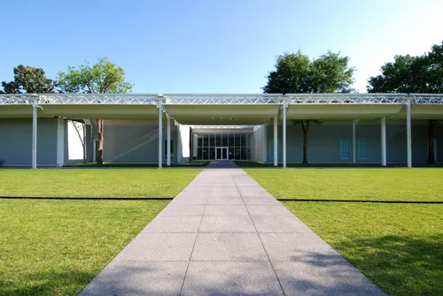 The sleek white Menil Collection museum with its inviting central walkway
