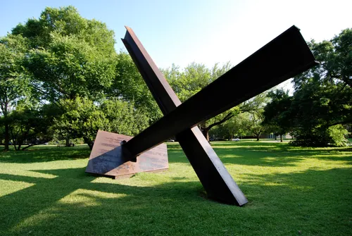 Bygones, Mark di Suvero's geometric steel sculpture, contrasts with green lawns