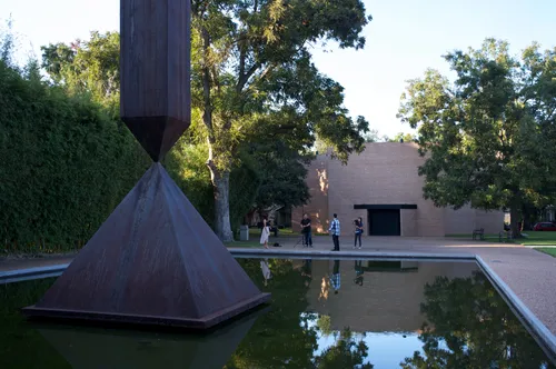 The Broken Obelisk stands sentinel by the reflecting pool near Rothko Chapel