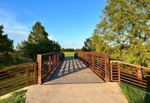 A footbridge crosses the reservoir's north tip