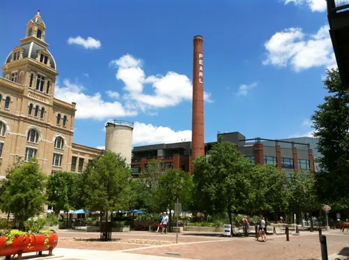 Historic smokestack rises above Pearl's plaza