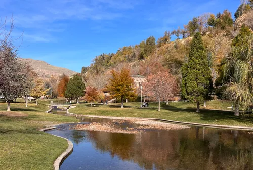 City Creek winds through the park beneath autumn-colored hills