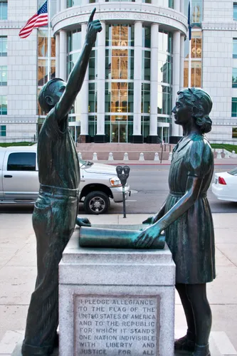 Pledge of Allegiance statue with Matheson Courthouse in background