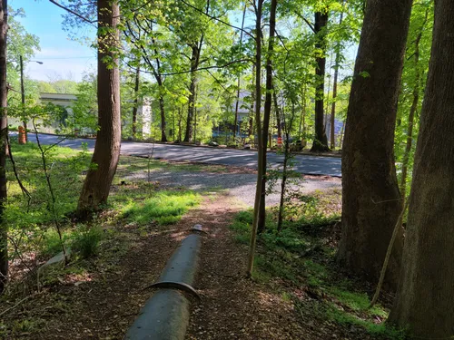 A pipe in the ground leads toward the Pump House
