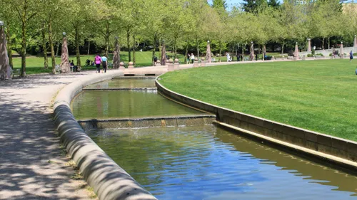 Visitors strolling along the tranquil waterway