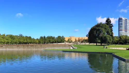 The park's pond with its waterfall in the distance