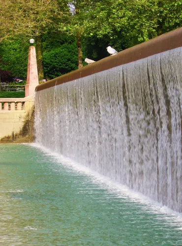 Water cascades down the stepped wall of the Infinite Fountain