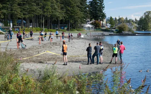 Visitors gather along the shore of Silver Lake for a cyclo-cross event