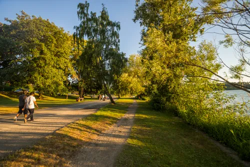 Visitors on a walking path along the shoreline