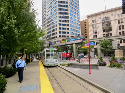 A streetcar and the Seattle Center Monorail pass through McGraw Square