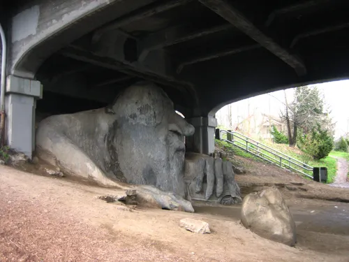 The Fremont Troll seen from the side beneath the Aurora Bridge