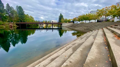 Terraced stone steps lead down to Spokane River