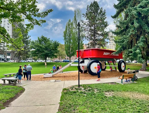 The iconic Big Red Wagon playground sculpture invites children to climb aboard