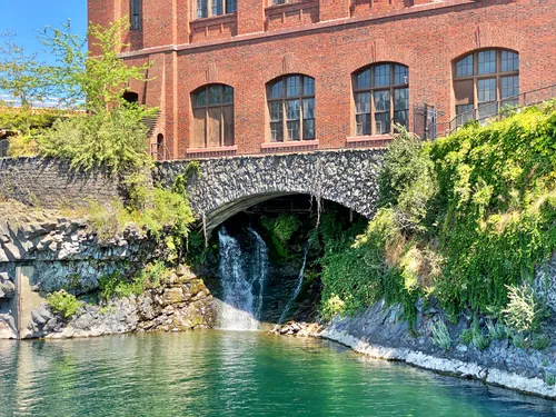 Historic brick building meets flowing water