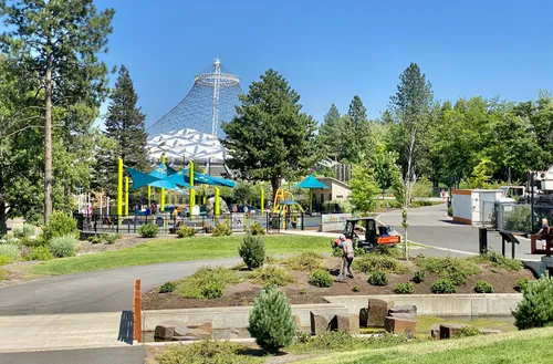 Colorful playground equipment with the United States Pavilion visible behind