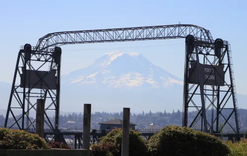 The Murray Morgan Bridge frames a view of Mount Rainier rising in the distance