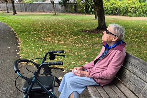 A visitor enjoys a peaceful moment in the park