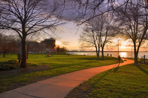 Sunset illuminates a walking path through the park