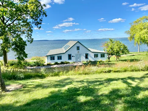 Charming white boathouse with Lake Mendota views