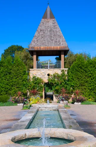 Fountain elements in front of a stone structure