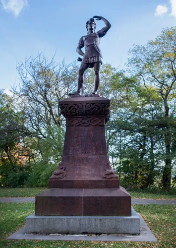 Anne Whitney's bronze Leif Ericson statue rises on its red sandstone pedestal