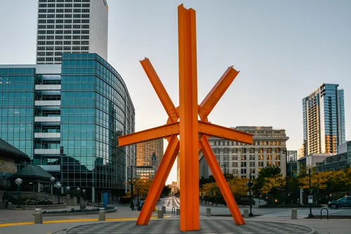 The Calling sculpture rises boldly with its orange steel beams against Milwaukee's skyline