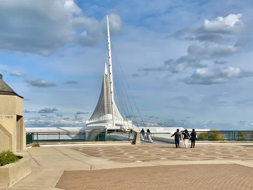 Visitors walking towards the Calatrava-designed wing structure of the Milwaukee Art Museum